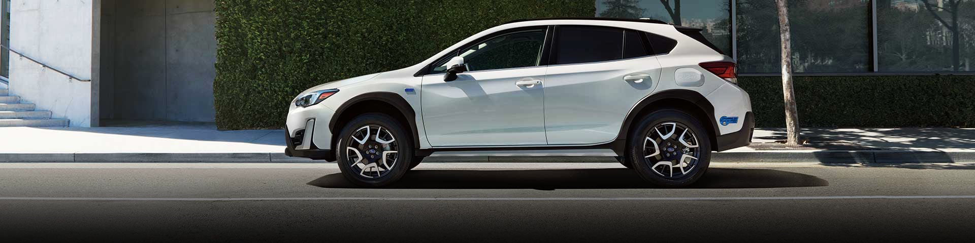 The side profile of a white Subaru Crosstrek Hybrid | Thelen Subaru in Bay City MI