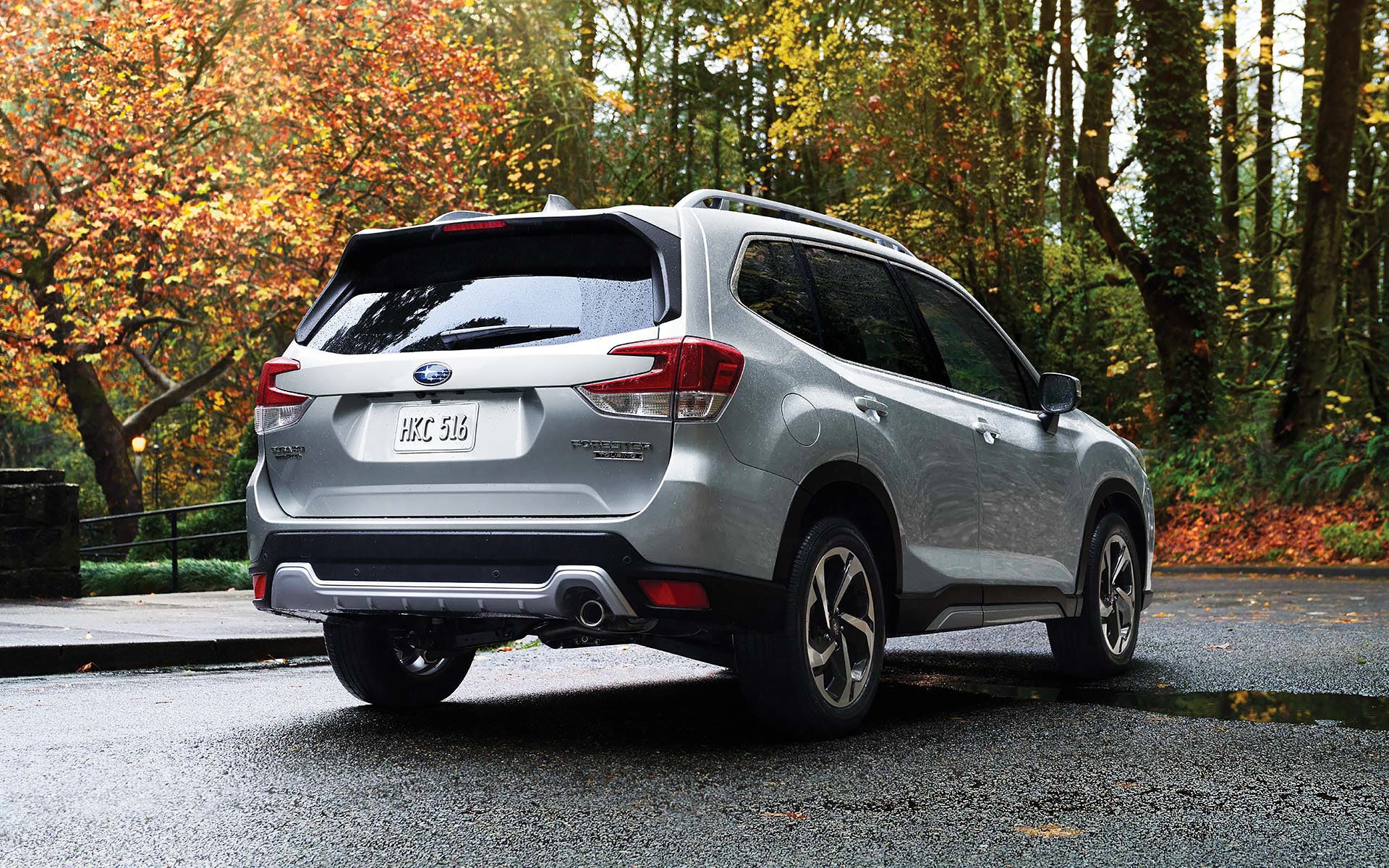 The rear of the 2022 Forester on a neighborhood street. | Thelen Subaru in Bay City MI