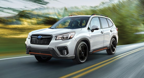 The 2022 Subaru Forester driving on a road.