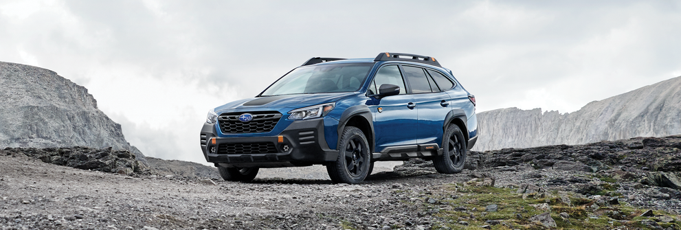 A 2023 Outback Wilderness parked in the mountains. | Thelen Subaru in Bay City MI